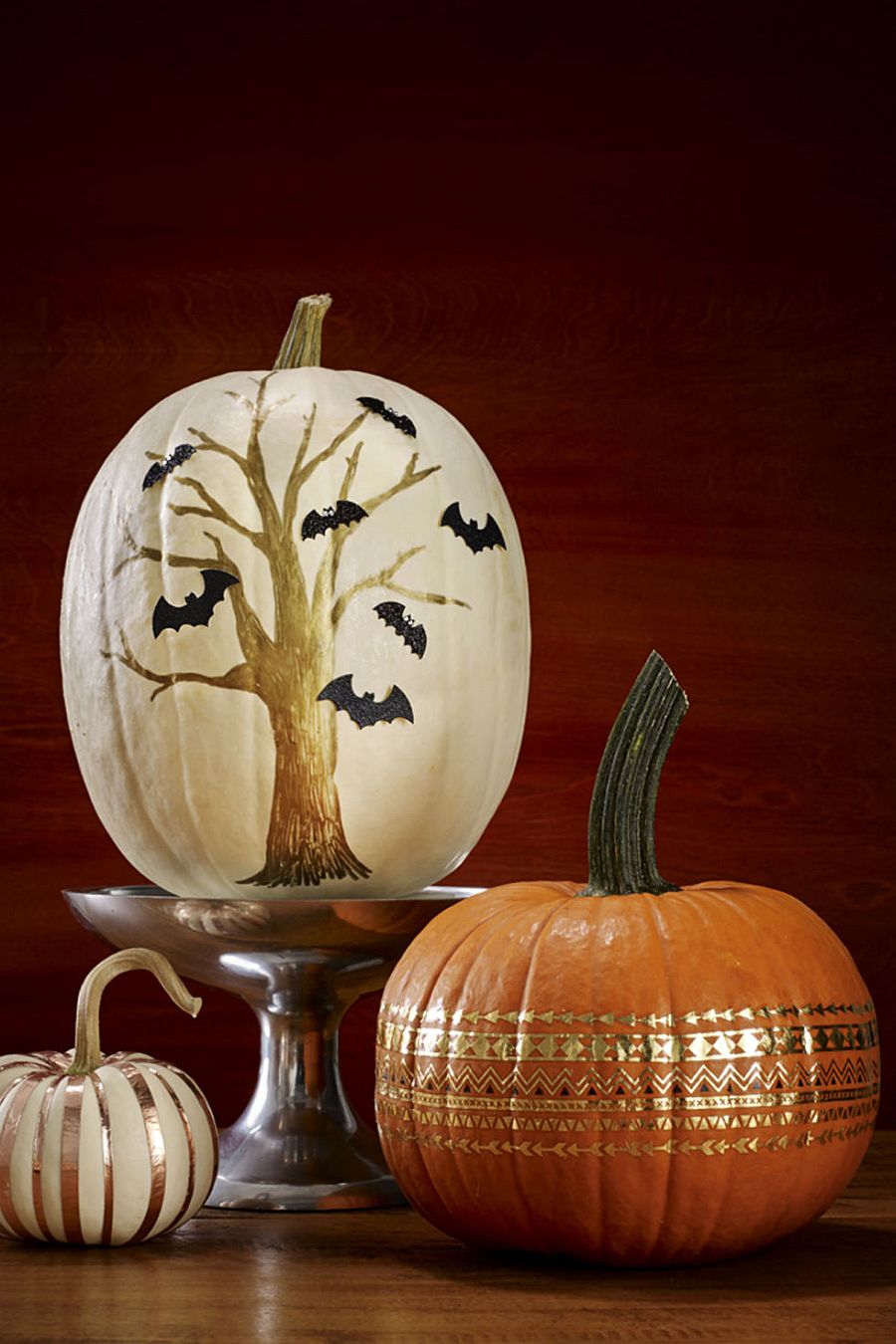 Painted pumpkin brings a touch of spooky charm to the Halloween setting
